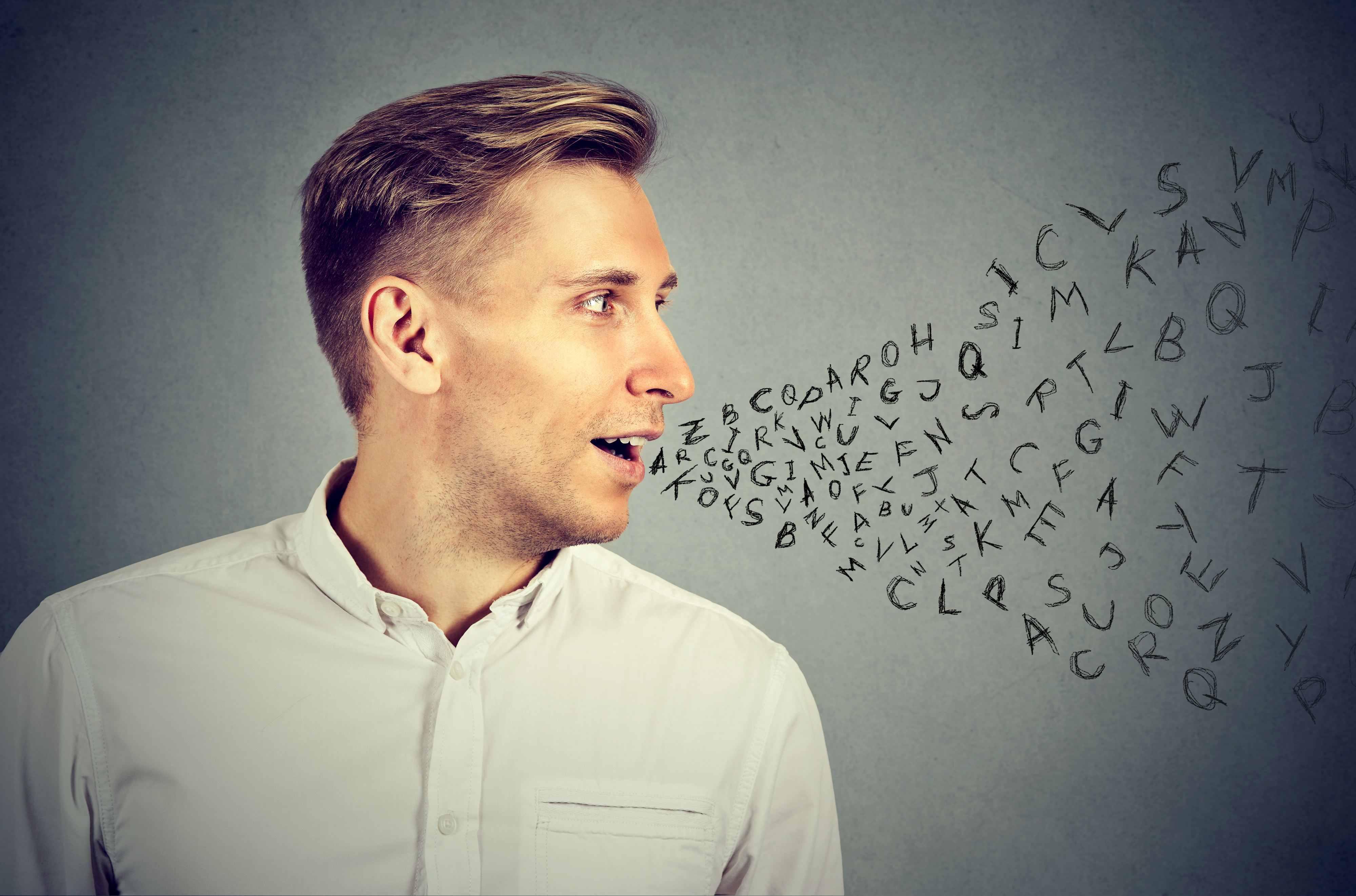 Man talking with alphabet letters coming out of his mouth