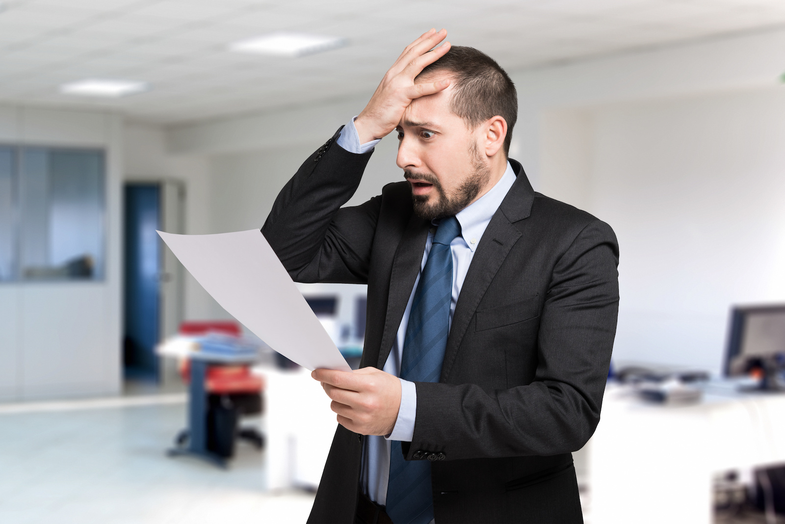 Desperate man reading a document