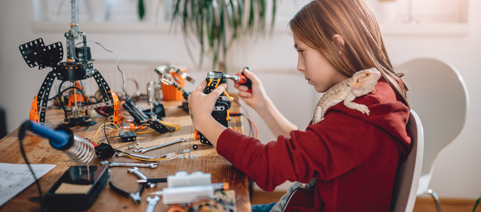 Girl building robot